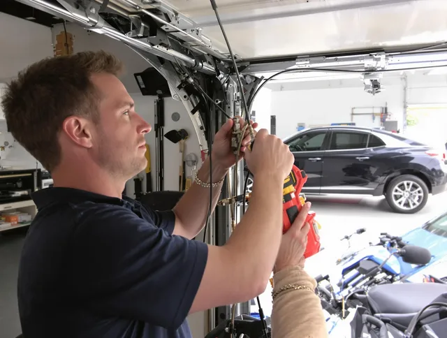 Old Saybrook Garage Door Repair safety certified technician performing cable replacement in Old Saybrook