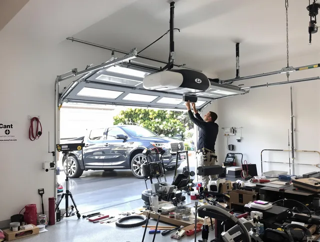 Old Saybrook Garage Door Repair specialist installing smart garage door opener system in Old Saybrook home